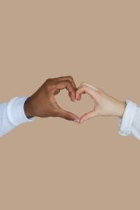 Two hands forming a heart shape together, symbolizing loving kindness meditation