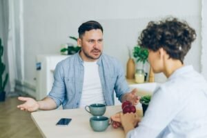 Couple having a calm, caring conversation while breaking up peacefully
