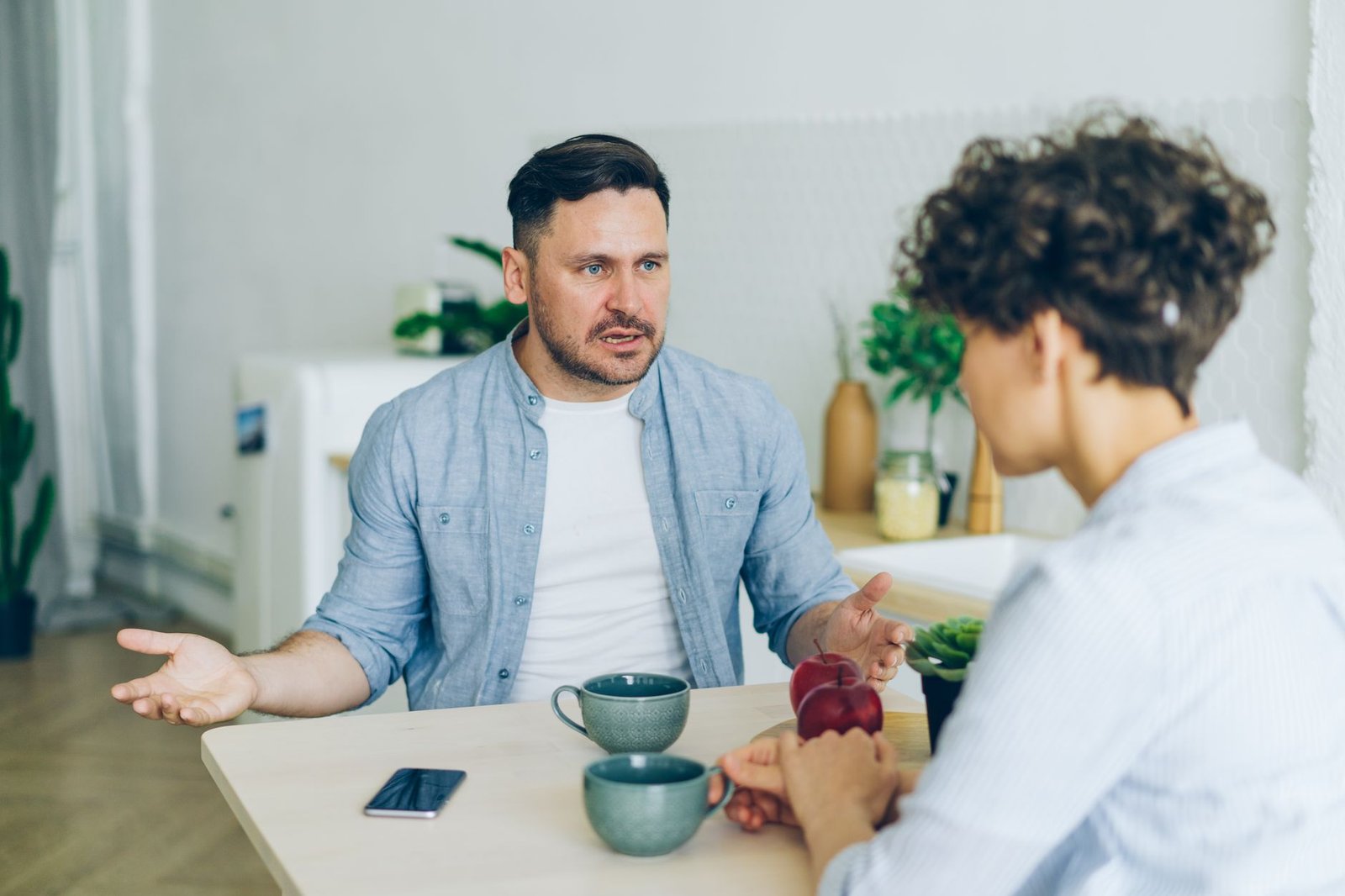 Couple having a calm, caring conversation while breaking up peacefully