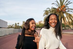 Two friends talking, illustrating how to say no politely to a friend without guilt