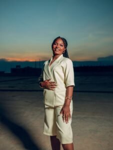 Confident woman standing tall at sunrise, embodying inner strength and empowerment