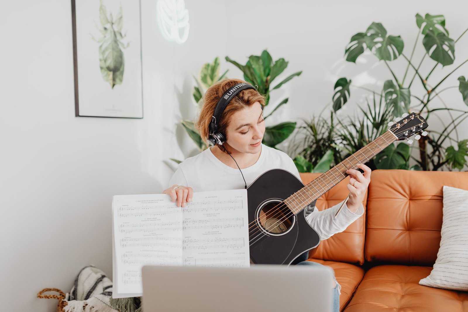 Person learning to play guitar, an example of neuroplasticity rewiring the brain through new skills