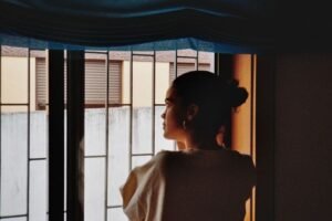 Woman calmly looking out at her surroundings, illustrating neuroception and the body’s sense of safety